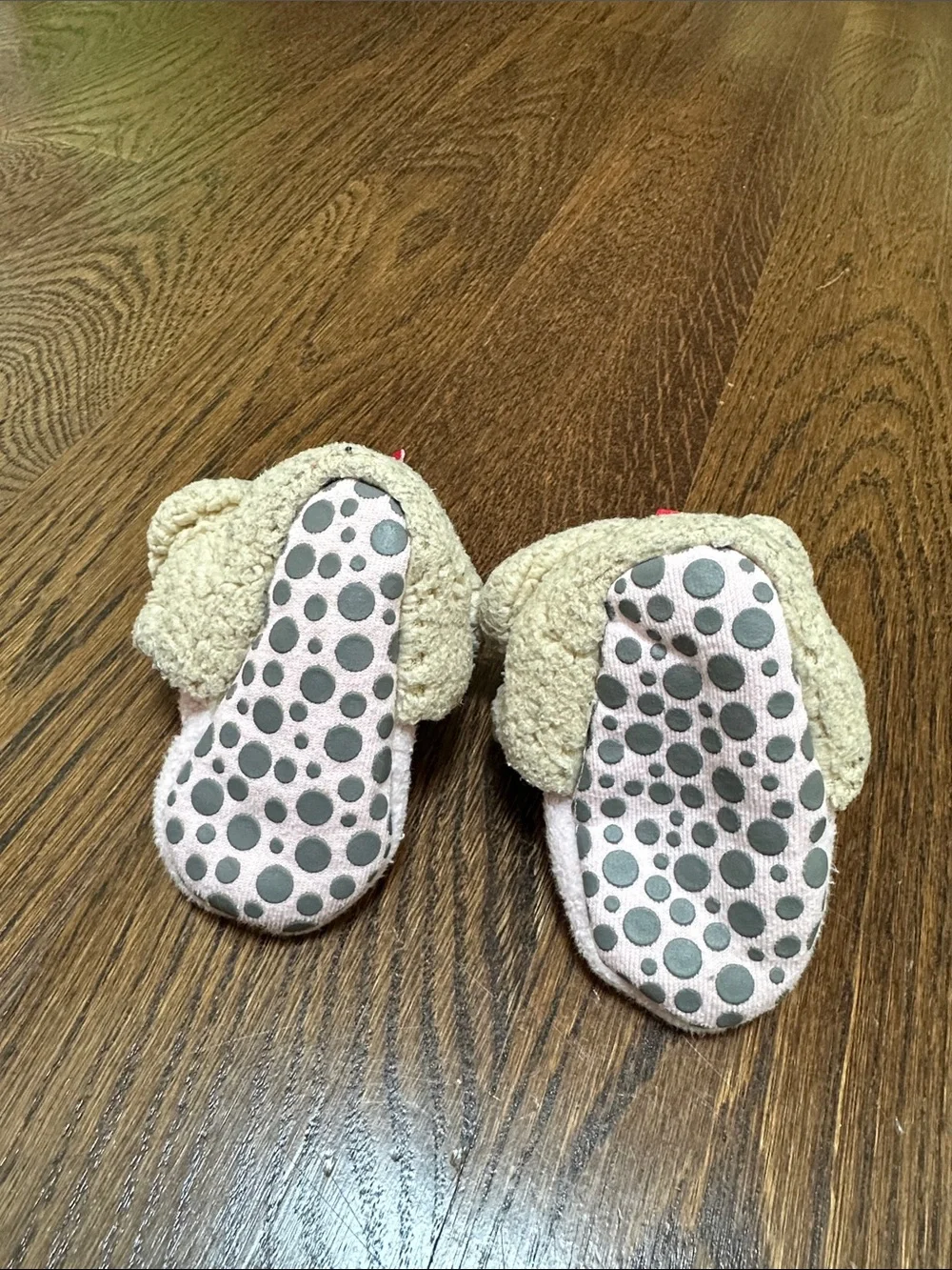 Two pairs of baby Zutano booties, 12M